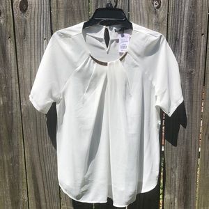 Short sleeve white flowy blouse with gold collar